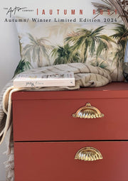 Earthy autumn-inspired interior using Autumn Rust wall paint and natural textures