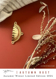 Autumn Rust wall paint styled with natural and gold accents for an exotic look
