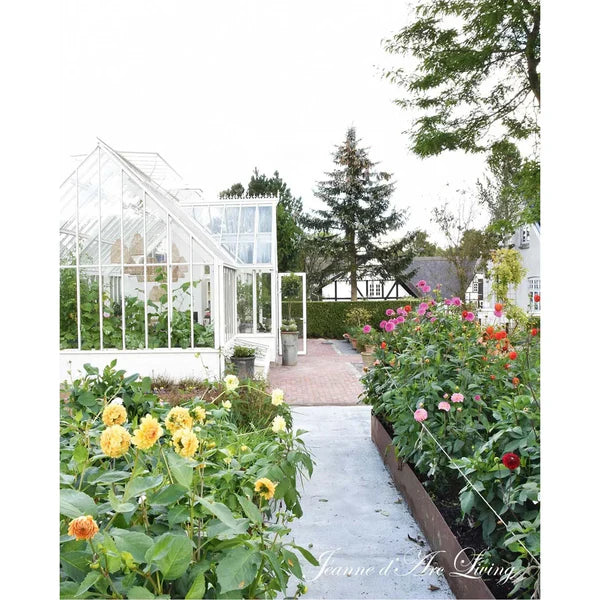 Greenhouse with garden pathway and flowers