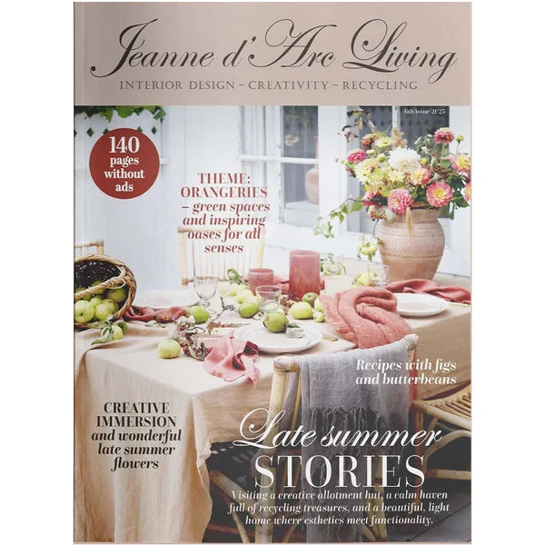 Magazine cover of 'Jeanne d'Arc Living' with a table setting and flowers.